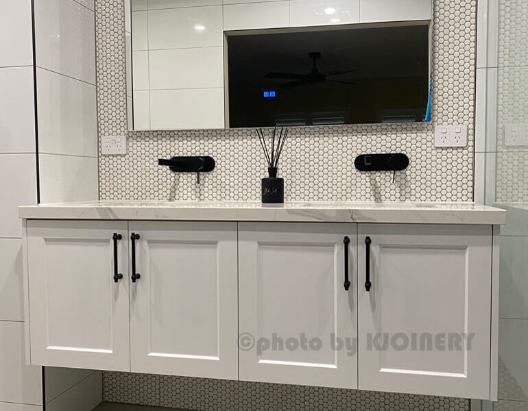 White bathroom vanity design Point Cook — moisture-resistant cabinetry with stone benchtop and undermount basin